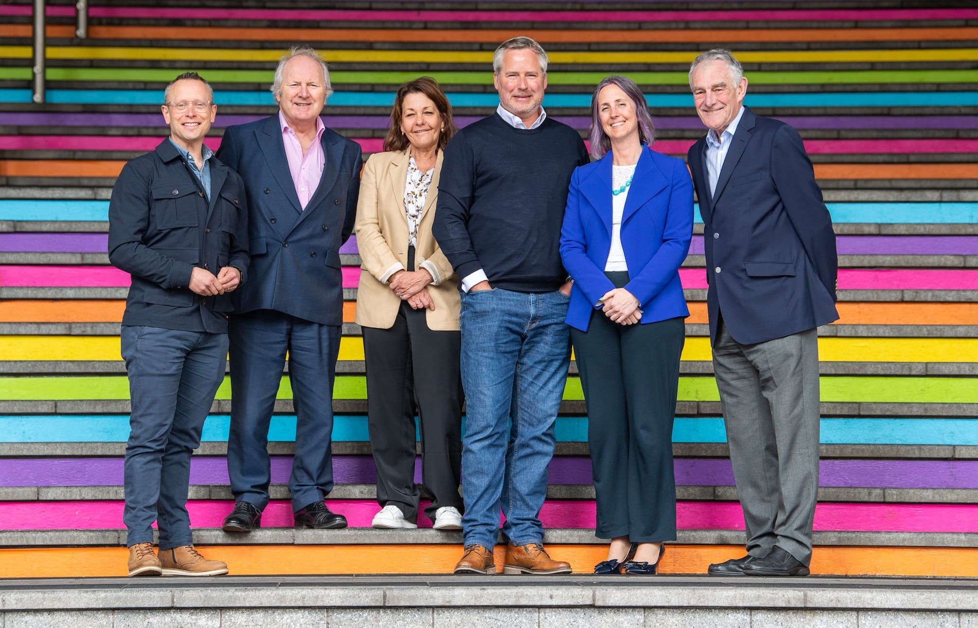 The Get A-Head board of trustees stood on some colourful steps.